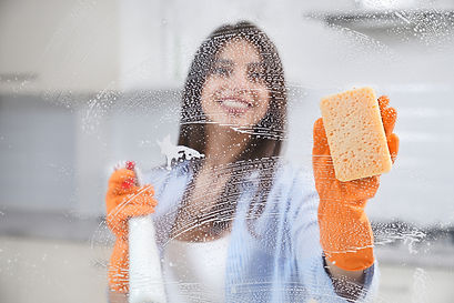 beautiful-woman-washing-window-rubber-gloves.jpg