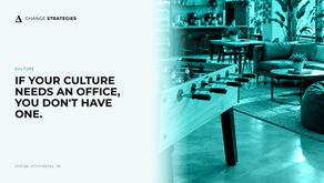 An empty modern startup office with a foosball table and casual employee perks.