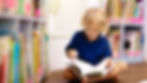 kid reading a book.