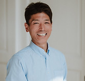 Smiling acupuncturist explaining treatment