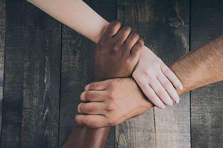 team-hands-linked-together.jpg