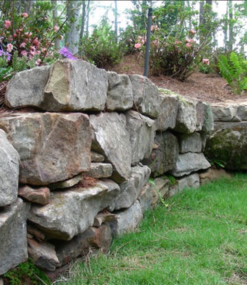 Large boulder retaining wall installation in Atlanta GA