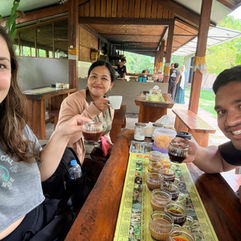 Three people njoying a tea ceremony in Bali