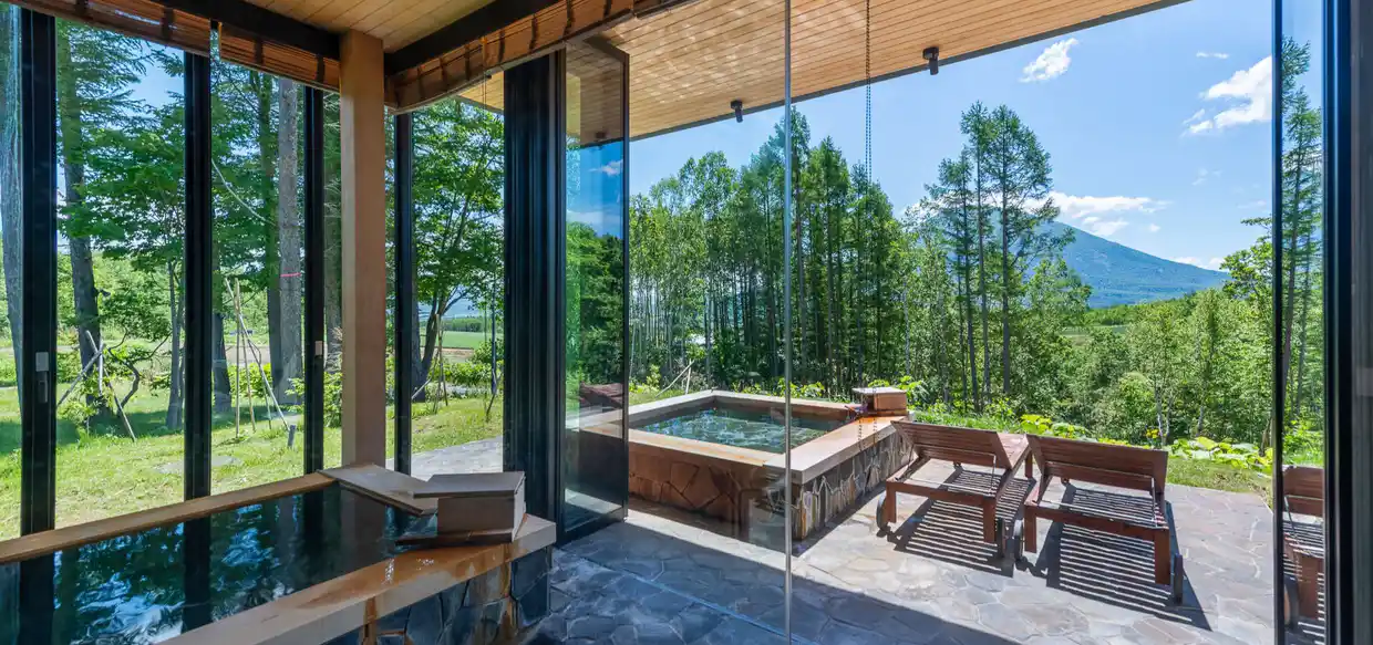 outdoor onsen with a view of mount yotei