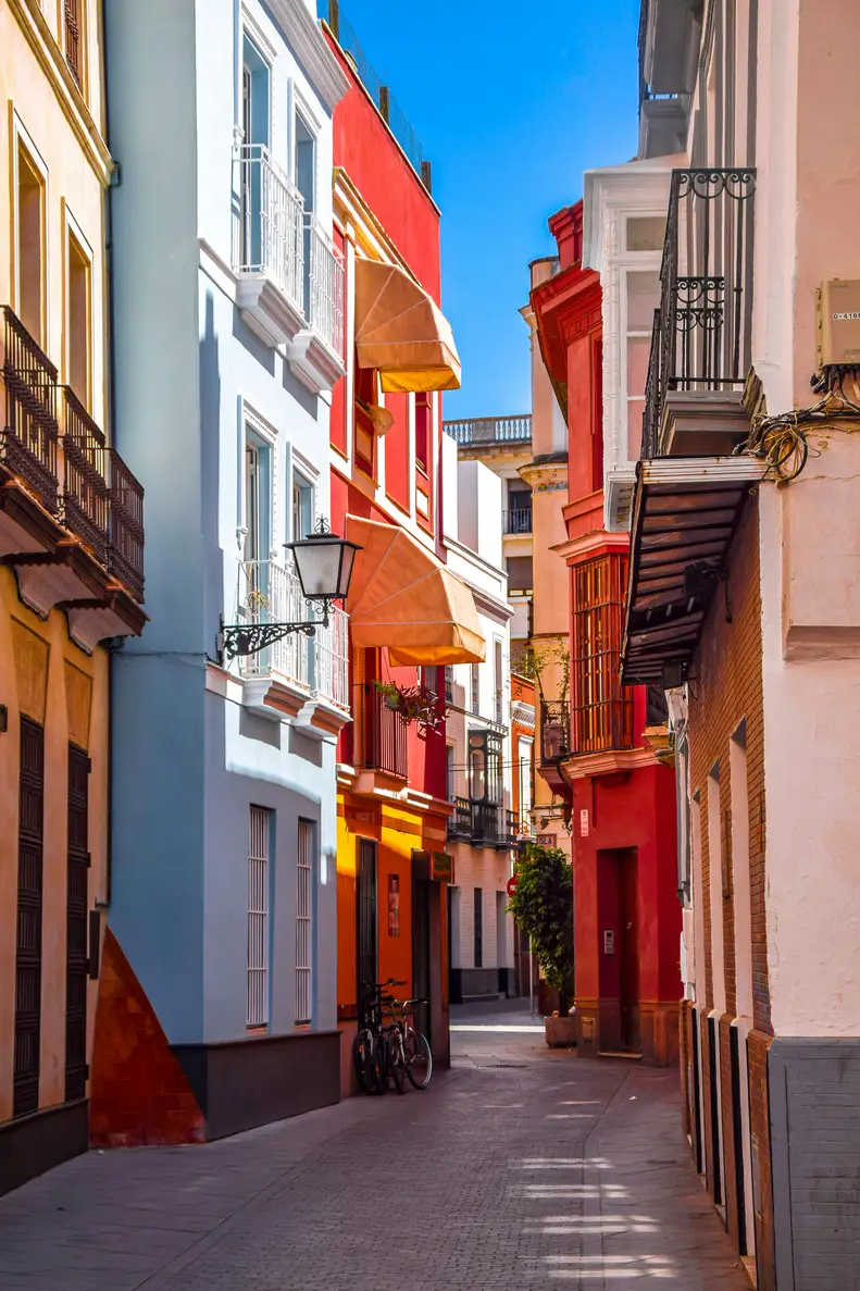 colourful buildings and cobblestone streets in Seville, Spain