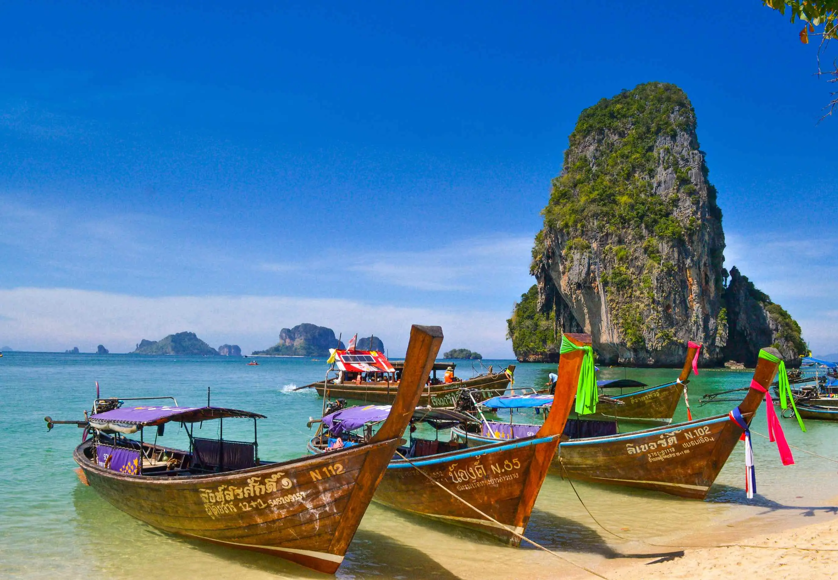 Long-tail boats on beach in Krabi, Thailand