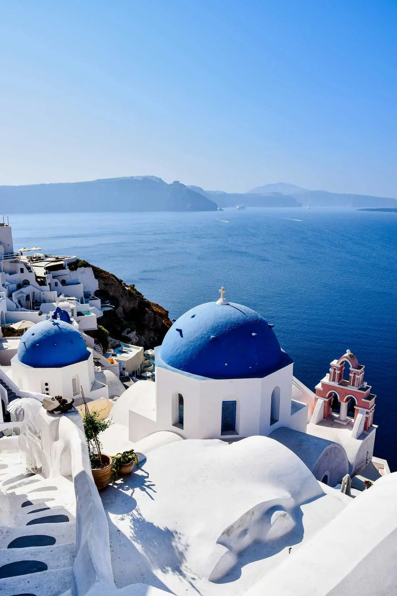 Whitewashed, blue-domed buildings in Santorini, Greece