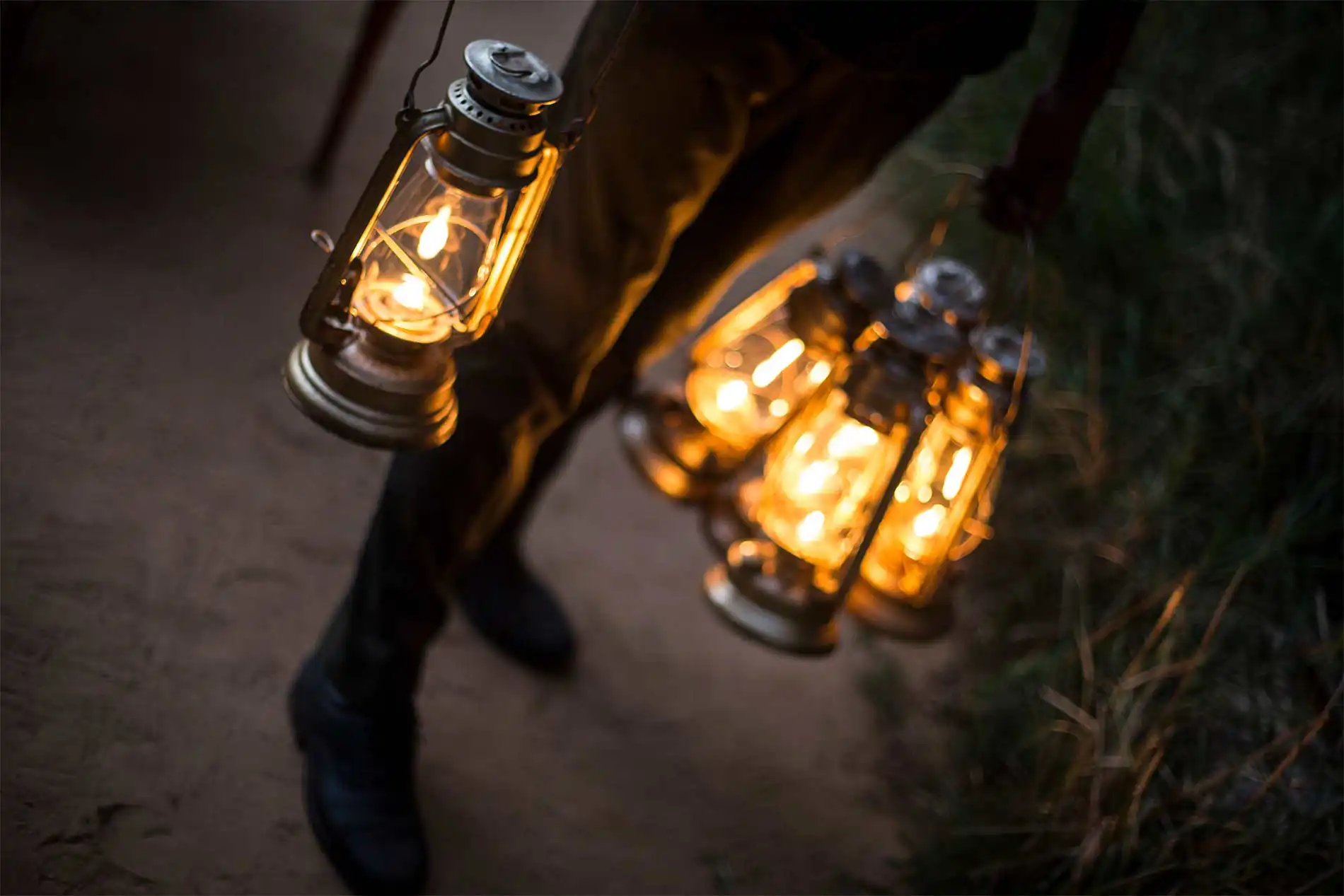  A man holding a collection of lanterns