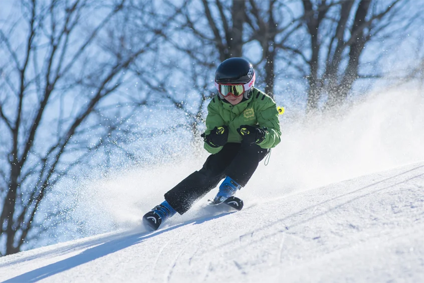 A young boy skiing 