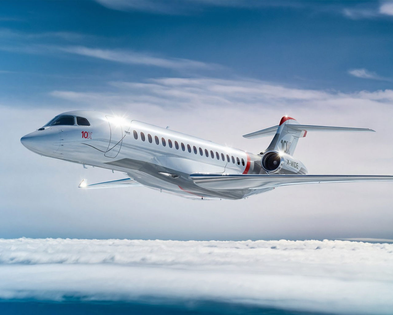 Dassault Aviation Falcon 10X business jet flying against blue sky