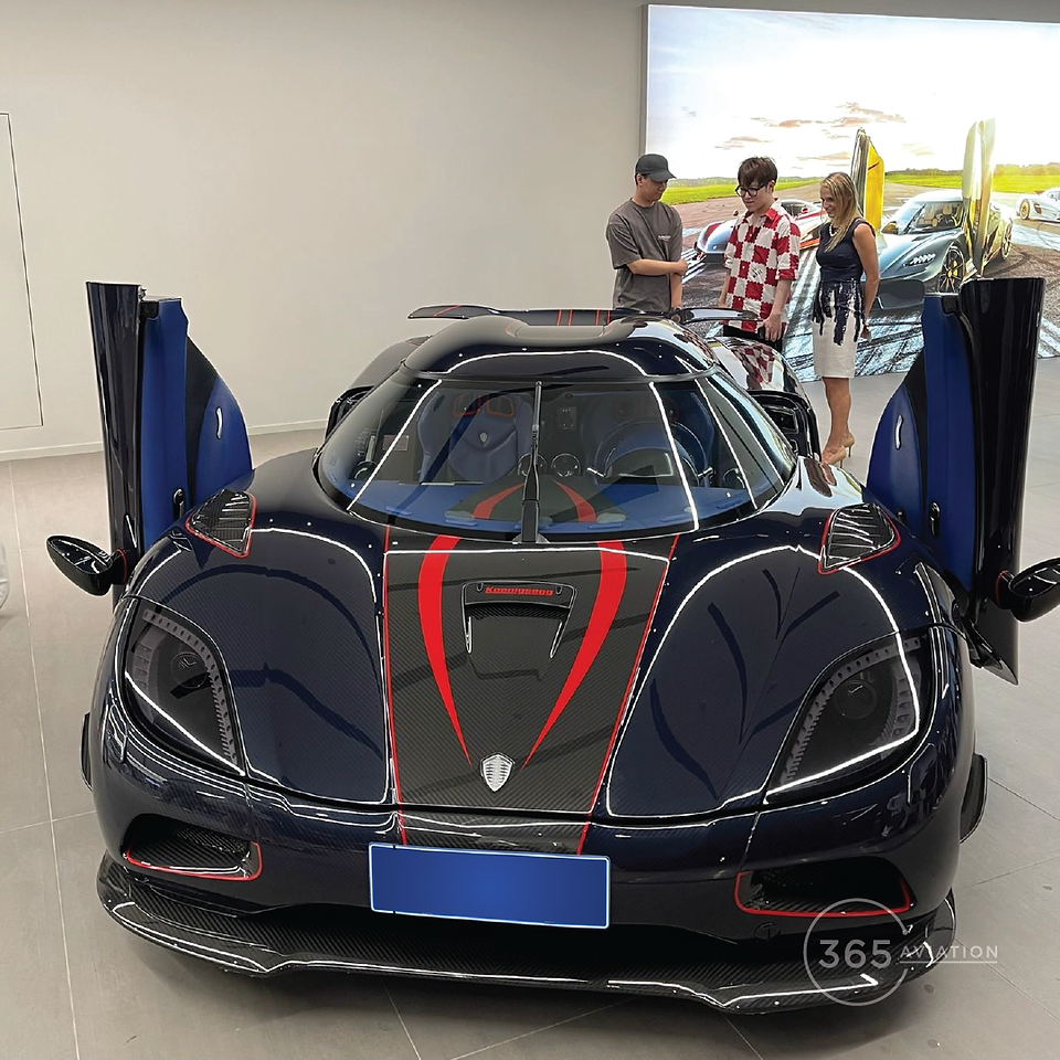A sports car is parked in a showroom