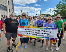 Church members in Pride Parade with sign