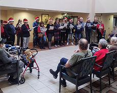 Church members caroling to nursing home residents