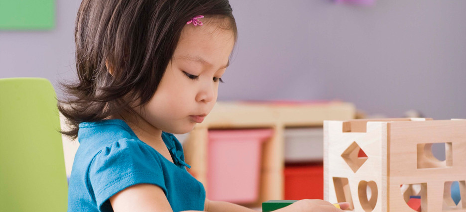young girl playing in daycare