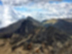 jagged mountain tops with clouds