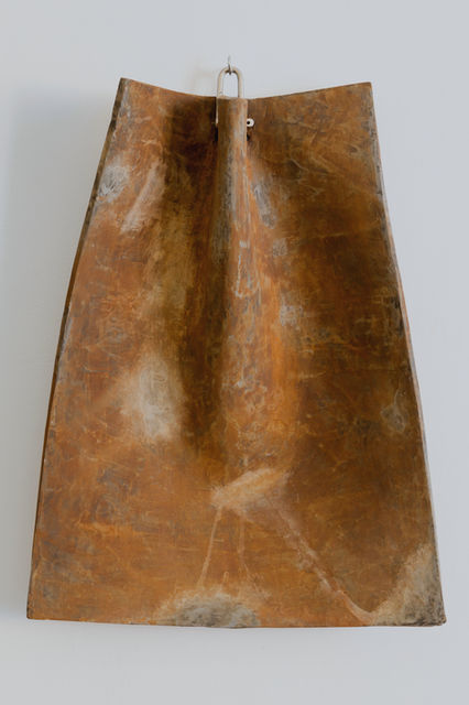 an abstract sculpture made of Jesmonite which looks like rust metal 