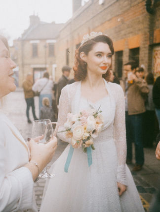 A bride in vintage dress in central london shot on 35mm film