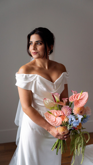 A bride looks out of a window