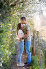 A couple backlit with a church in the background