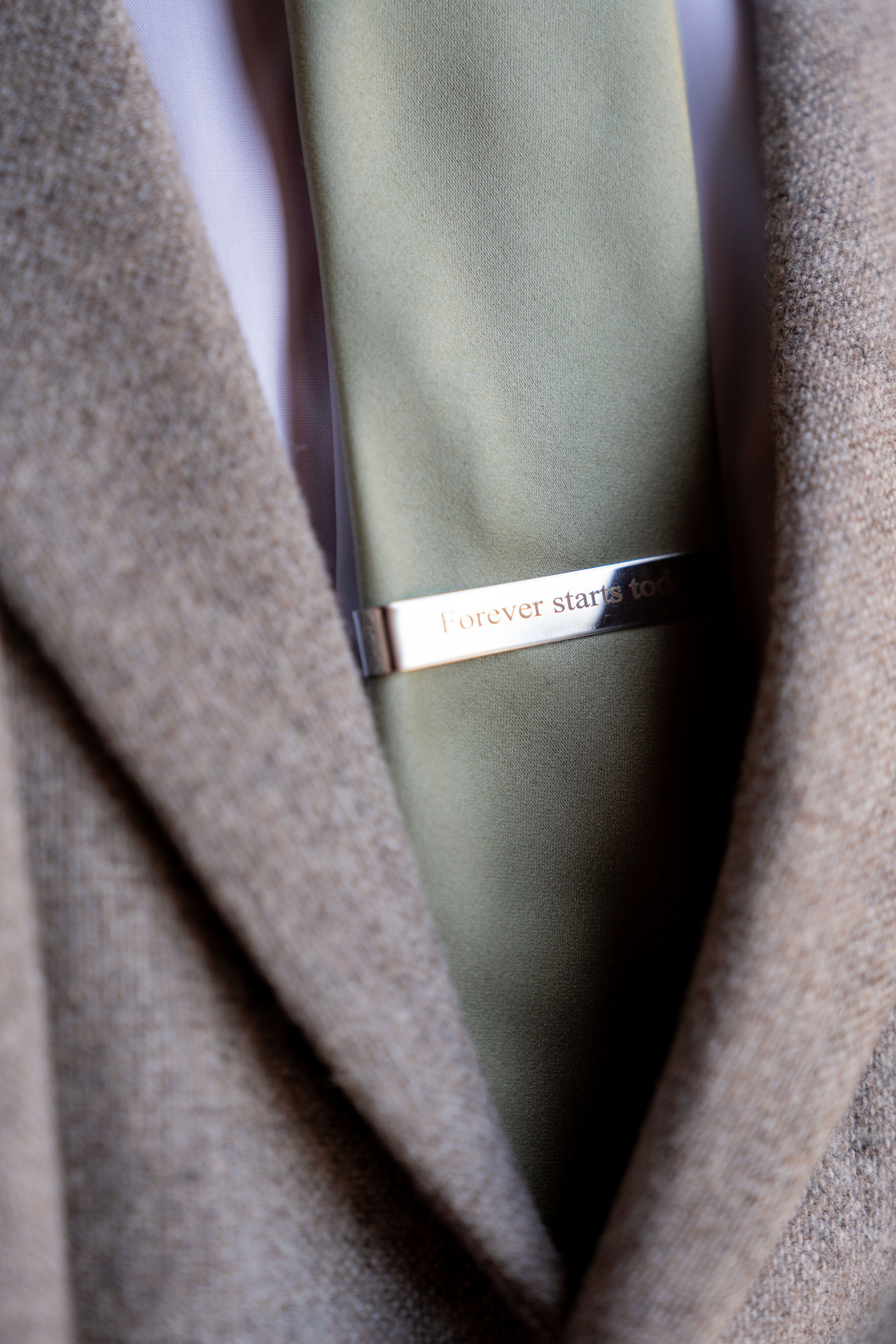 Forever Starts Now Tie pin on a green tie 