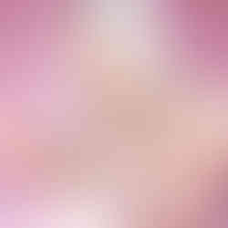 Blonde eats cake from a long decorative spoon