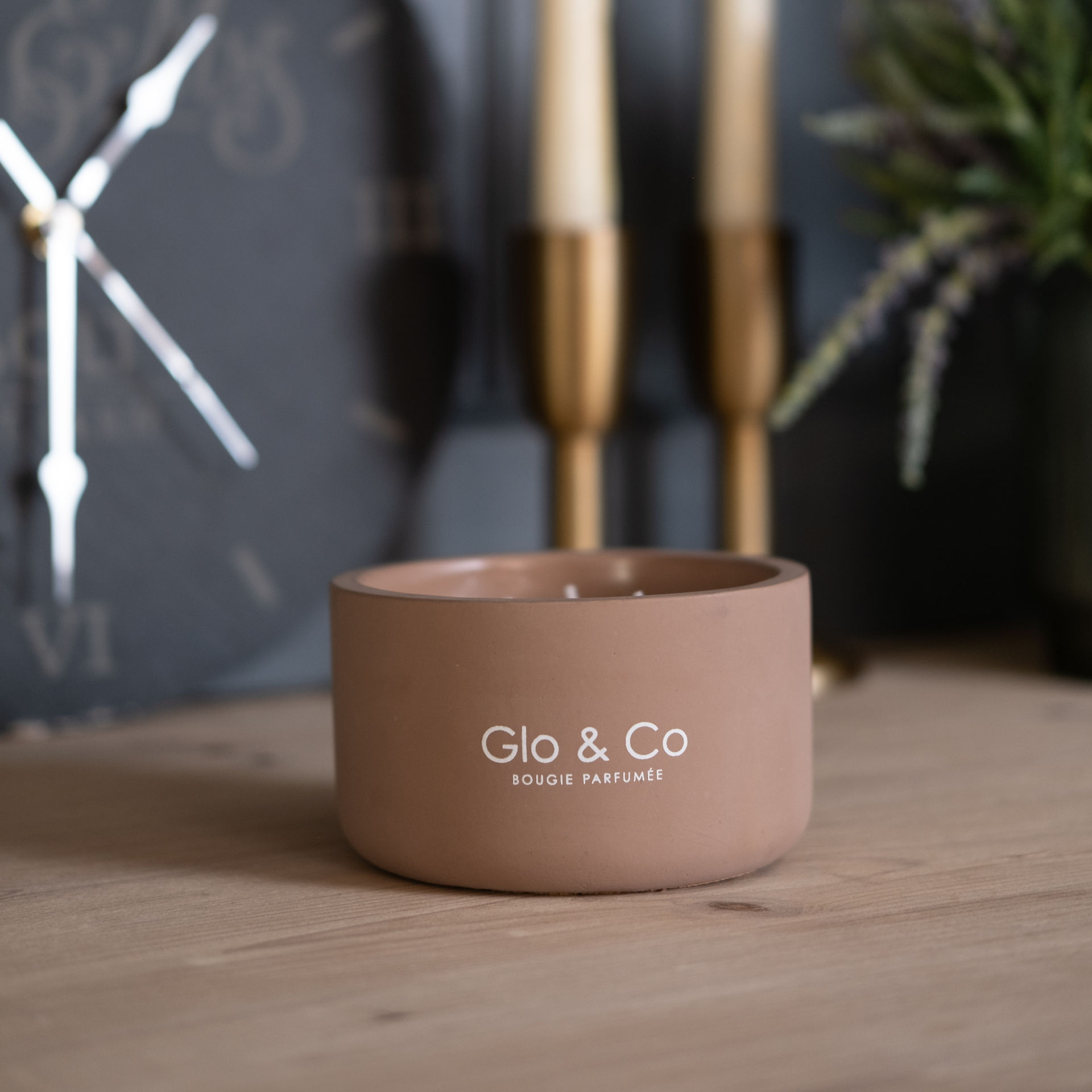 Glo and Co candle on a cabinet