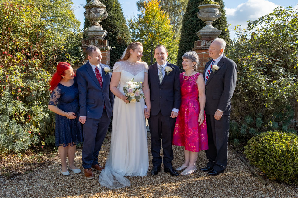 A Bridal Party group photo in a walled garden