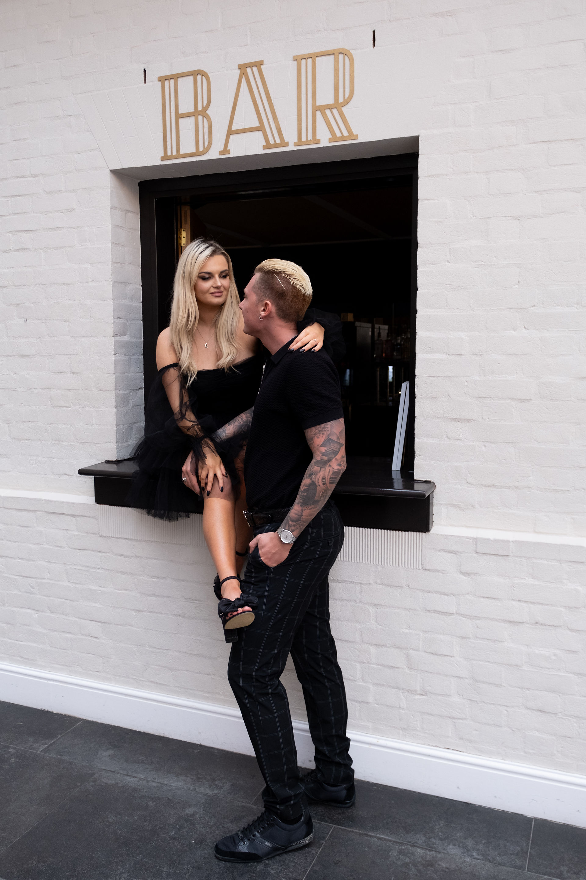 Botleys Mansion, couple sit at a bar