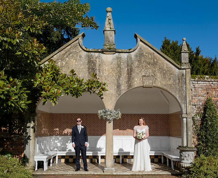 A bridal party walk towards the camera at Shaw house 