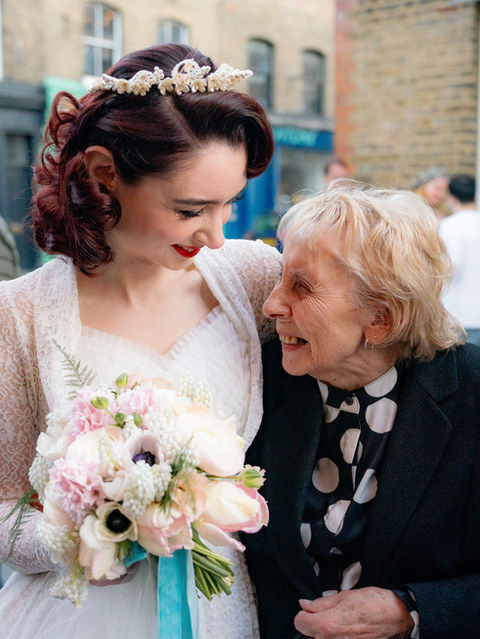 A bride and her grandma share a hug