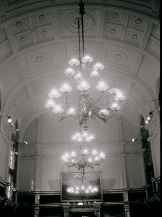 Black and white 35mm film image of chandeliers
