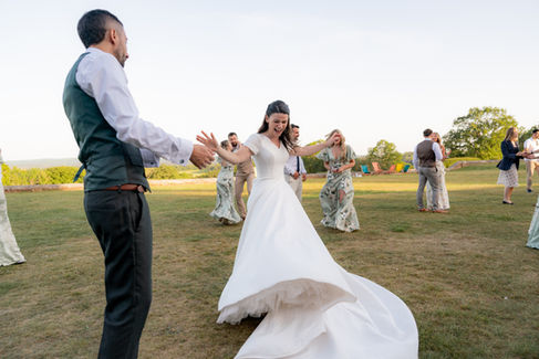 A bride spins in her dress at Frensham Hall Weddings