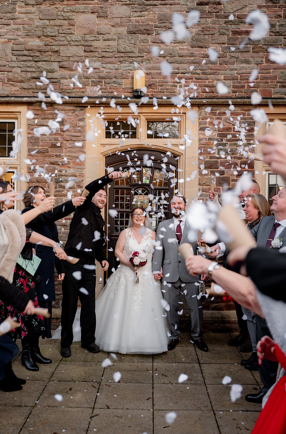 Confetti shot for a bride and groom at poole court registry office