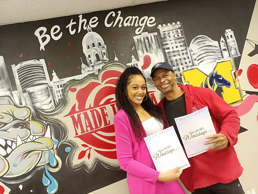 Pasadena author/public speaker, Talyn Nelson, posing with her new book at Pasadena Mayoral Candidate, Allen Shay