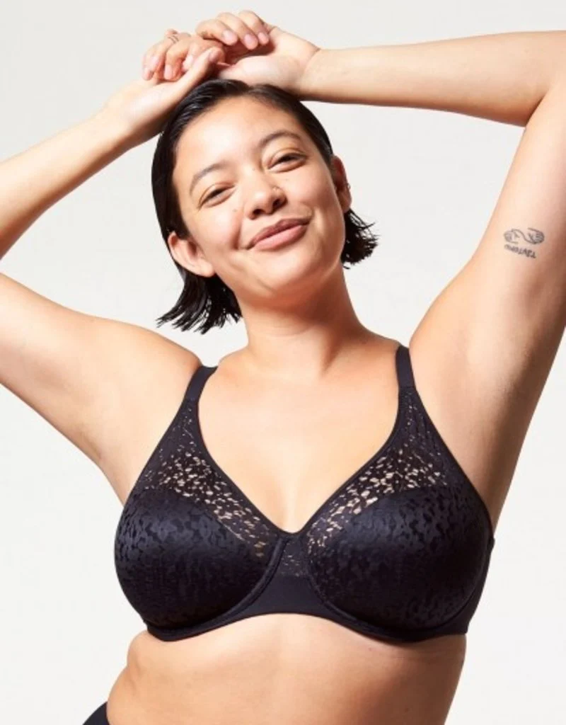 Woman wearing a black Chantelle Norah Comfort bra, front view.