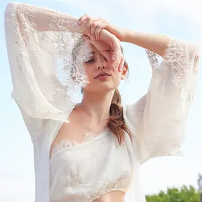 Woman wearing Rya Anniversary robe & chemise.