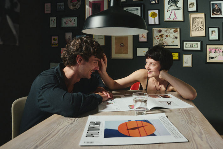 Lifestyle storytelling image of two people sharing a quiet moment at home in Hamburg, photographed with a cinematic tone
