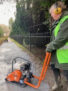 Jane operating the "wacker plate"