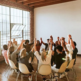 Download premium image of Group of diverse people holding hands up in the air by Felix abo