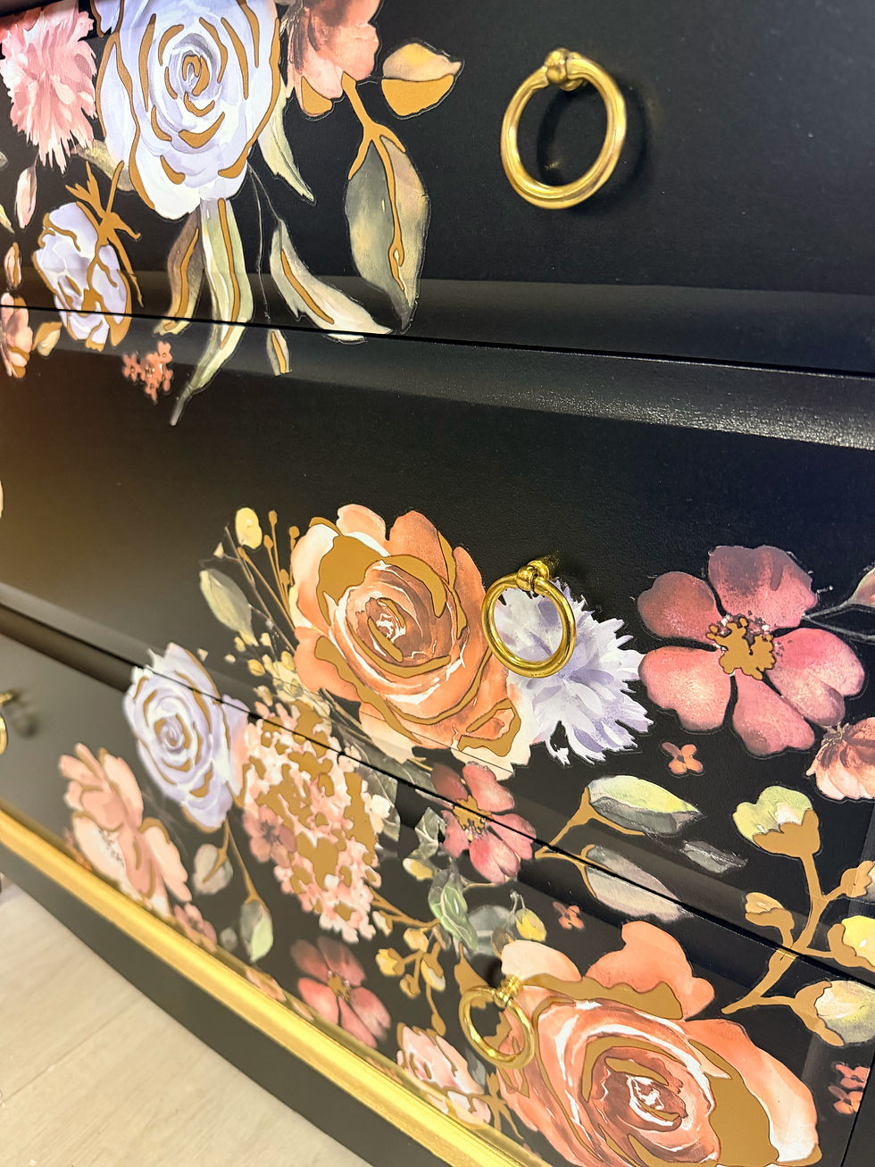 Thumbnail: Black floral chest of drawers styled in a bedroom or interior setting