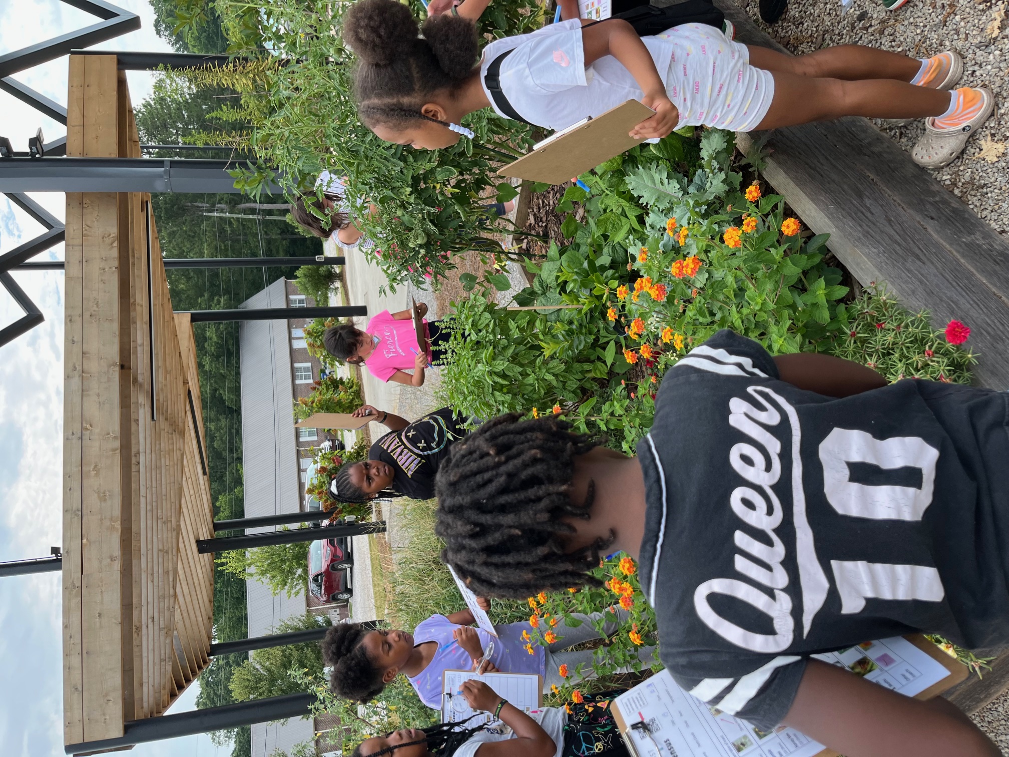 Community members gardening at Wimberly's Roots