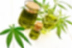 Hemp oil in two glass jars and sauceboat