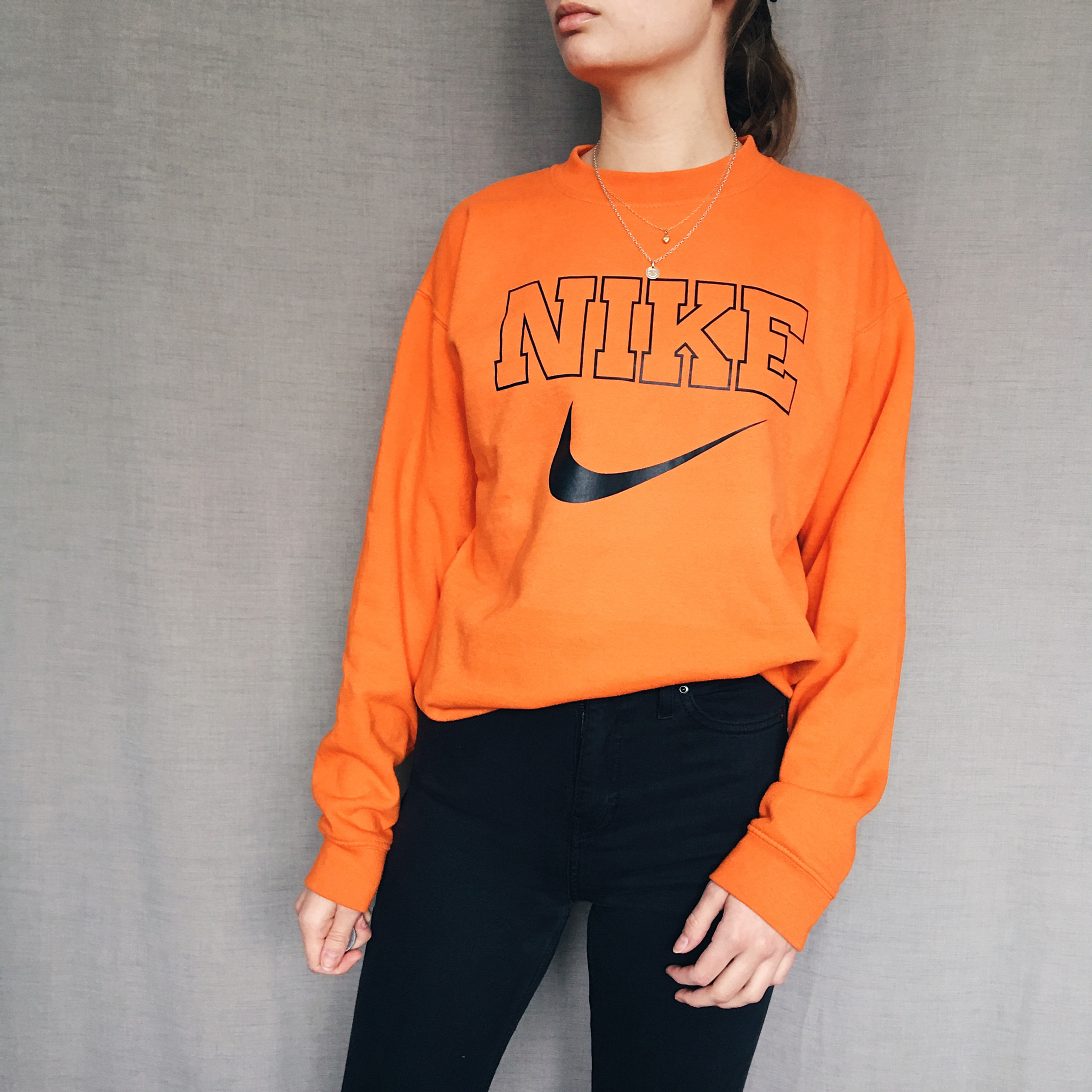 Bright orange fake Nike sweatshirt