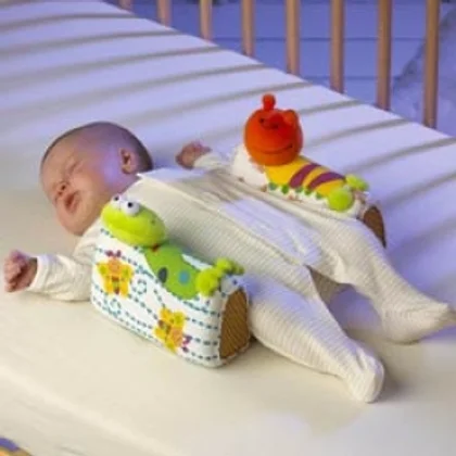 the first years sleep positioner