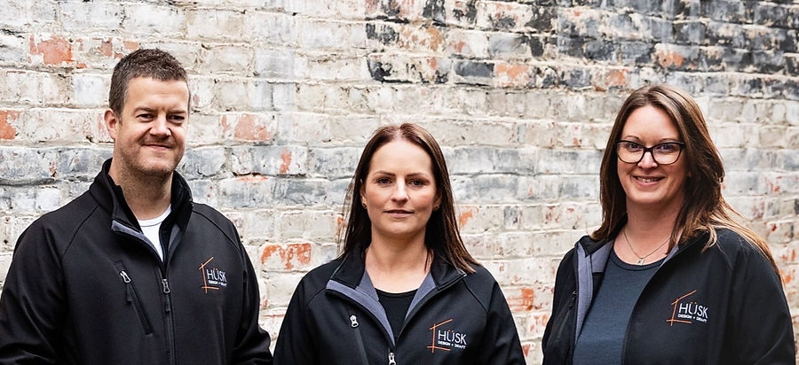 husk team photo infront of brick wall_edited_edited_edited_edited_edited.jpg