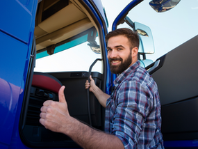 Truck driver in front of the truck