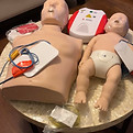 Adult and infant mankin with AED.jpg