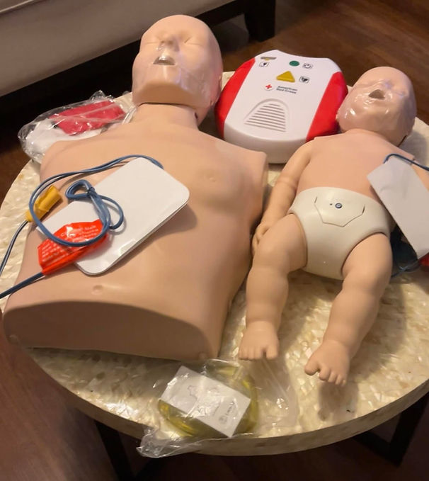 Adult and infant mankin with AED.jpg