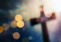 Beautiful bokeh with a cross in the back