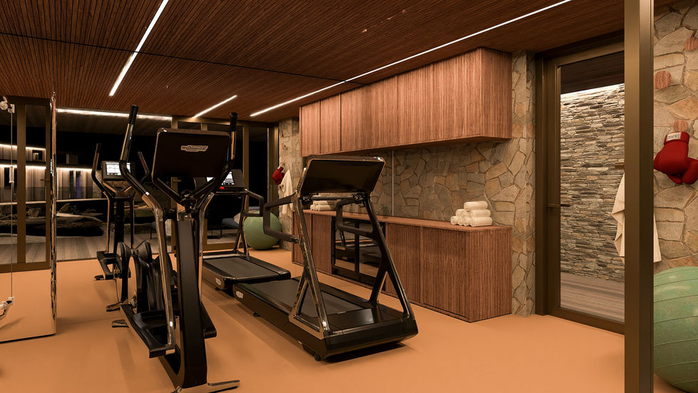 Luxury residential fitness pavilion featuring natural stone walls, custom millwork, professional exercise equipment, and floor-to-ceiling glazing overlooking landscaped courtyards